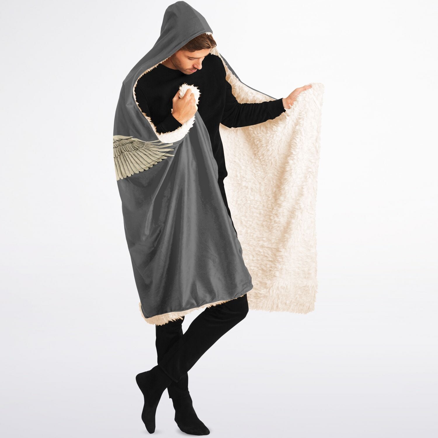 Person wearing a gray hooded poncho with a white interior on a white background