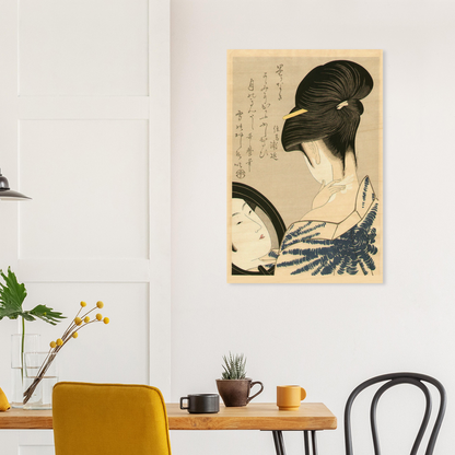 Framed artwork of a traditional Japanese woman on a wall above a dining table with chairs.