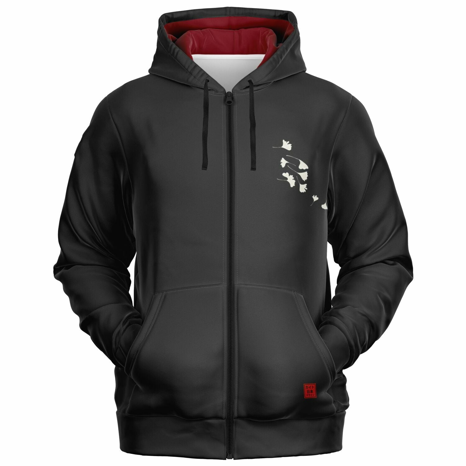 A black zip-up hoodie with a red interior hood lining, black drawstrings, a front kangaroo pocket, and a small white graphic of cats on the left chest.