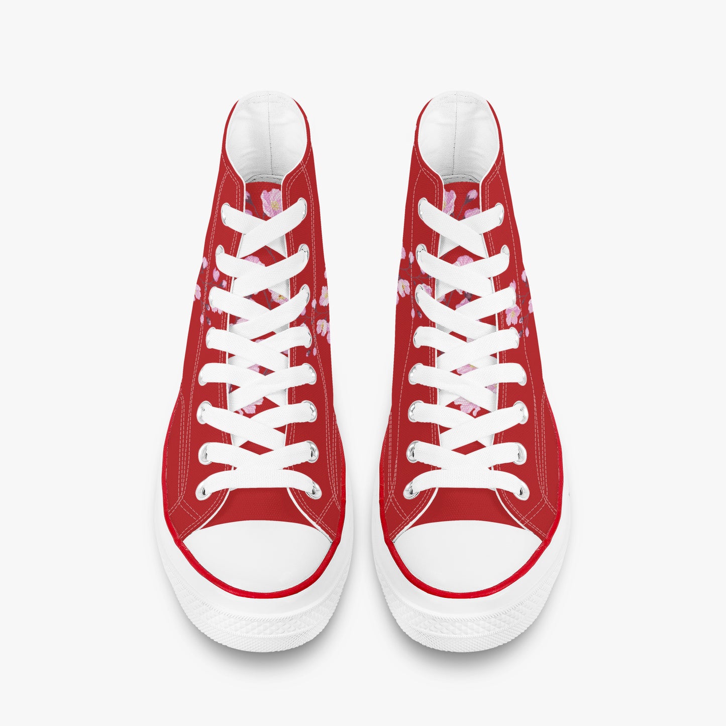 Red high-top sneakers with white laces on a white background
