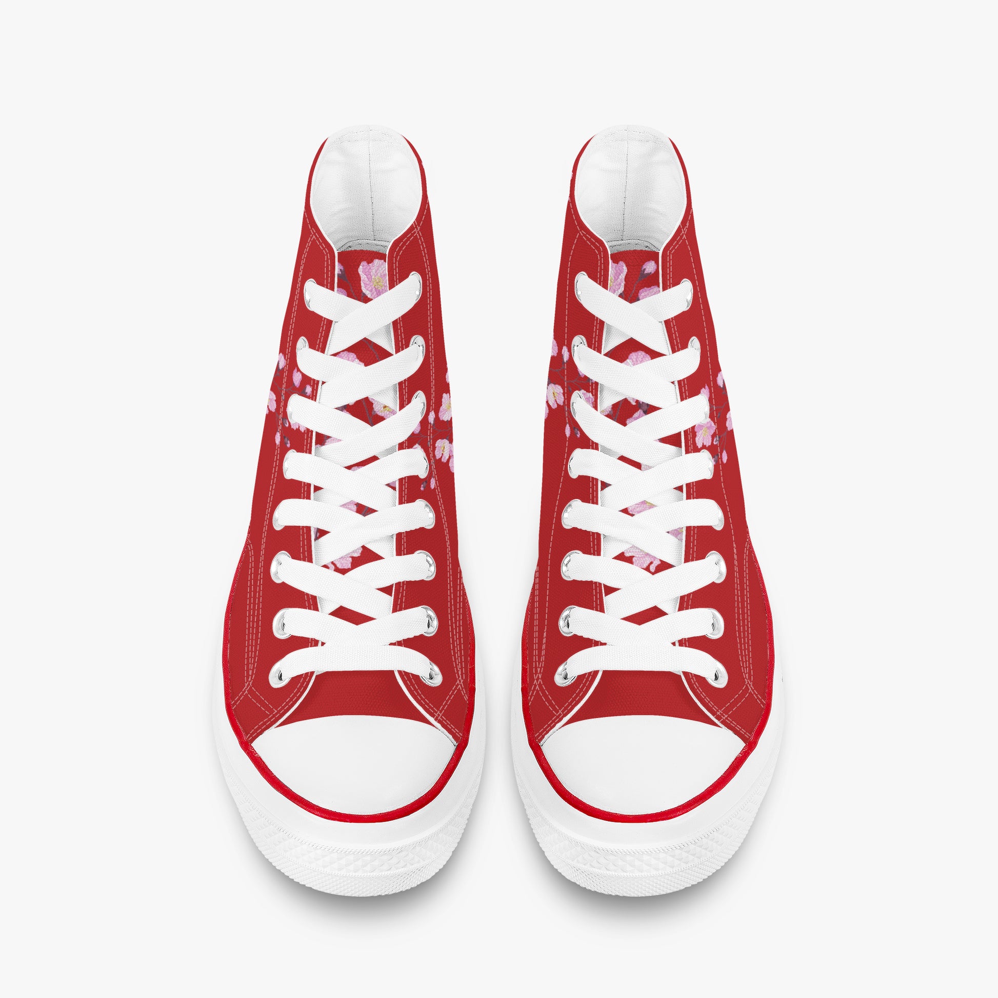 Red high-top sneakers with white laces on a white background