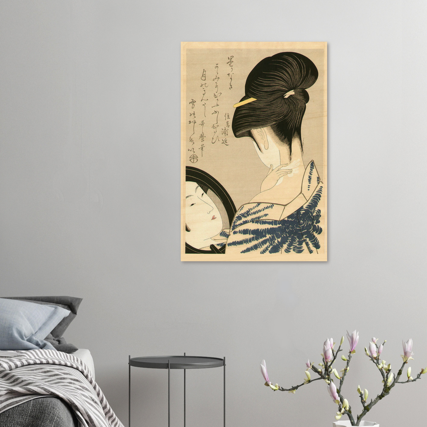 Framed artwork of a traditional Japanese woman on a gray wall above a bed.