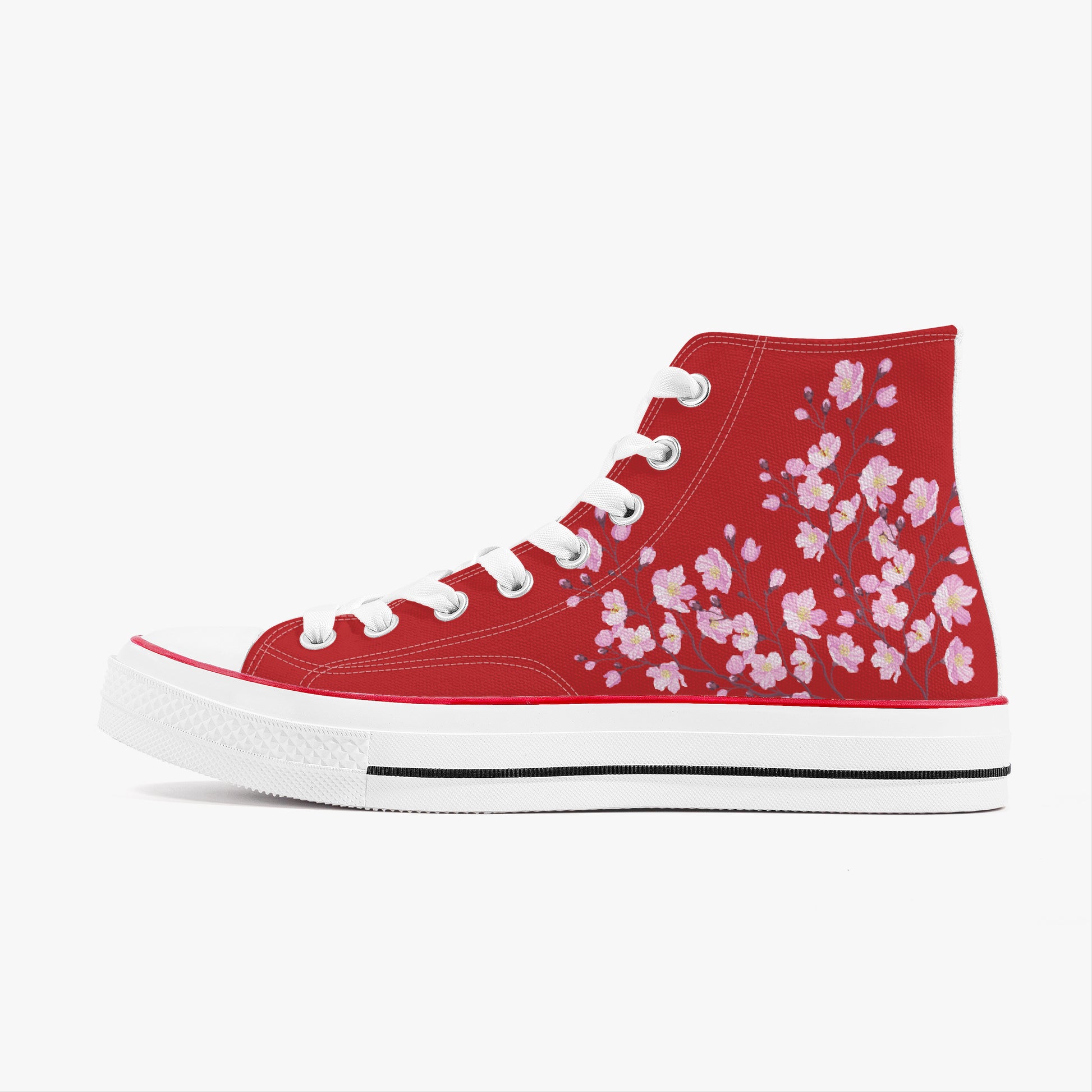Black high-top sneaker with pink floral pattern on a white background