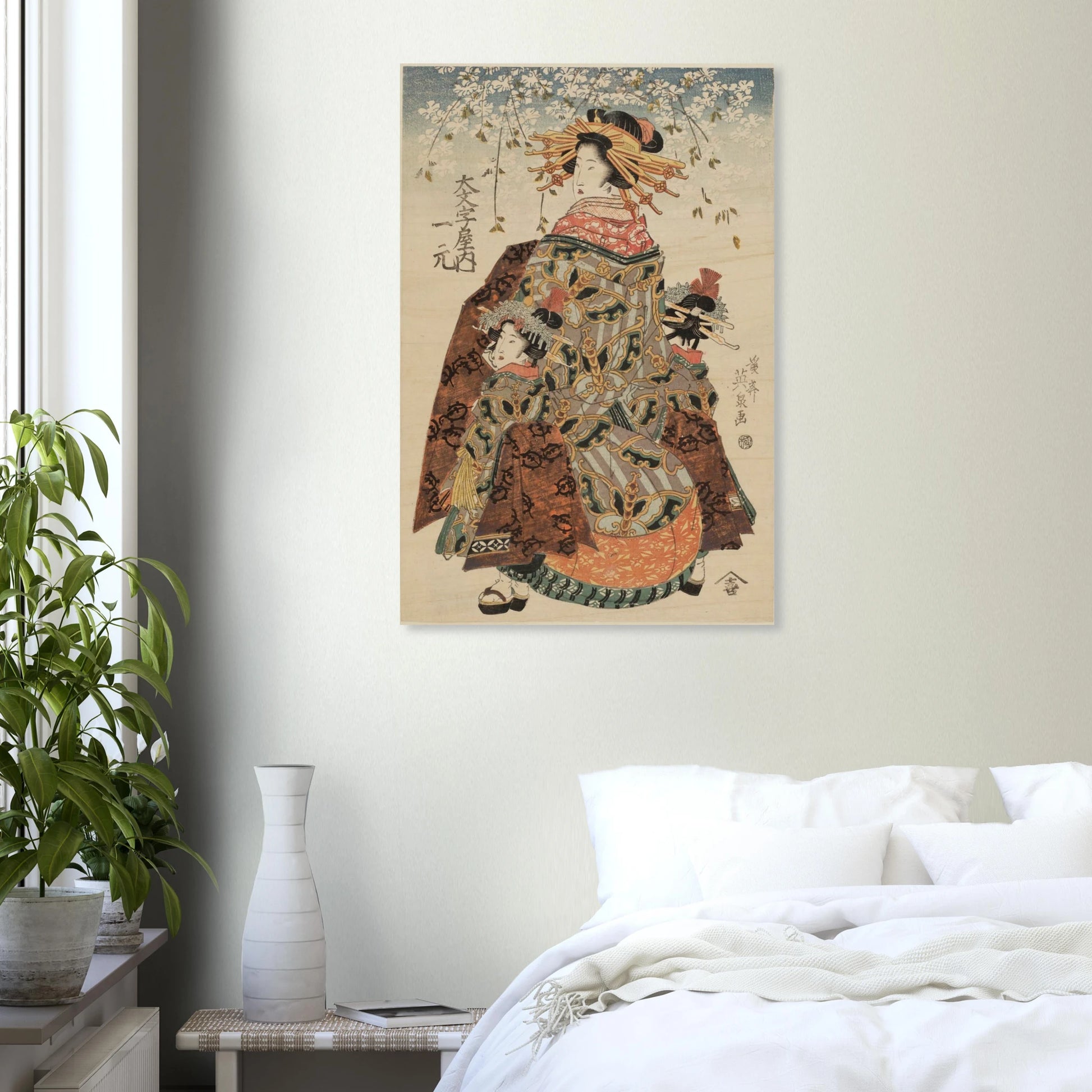 Traditional Japanese artwork of a geisha on a wall in a bedroom with a plant and bed.