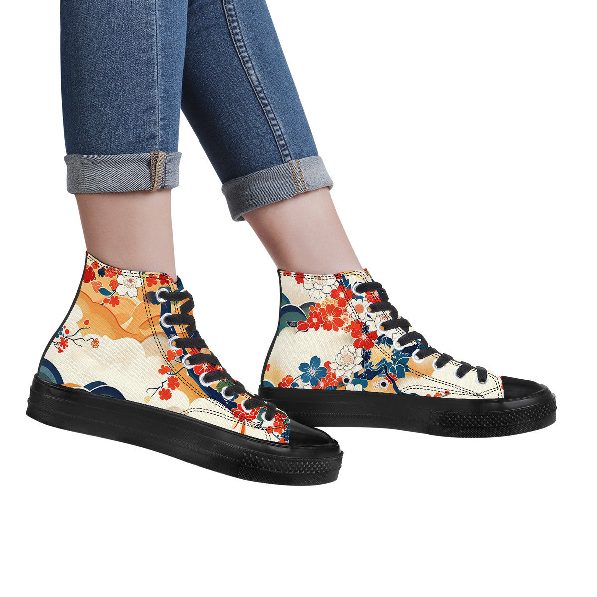 Colorful floral high-top sneakers worn with rolled-up jeans on a white background