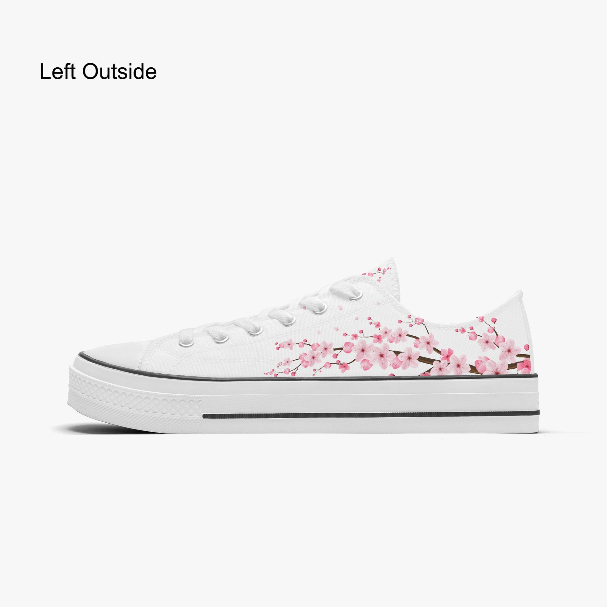 White sneaker with pink floral design on a white background