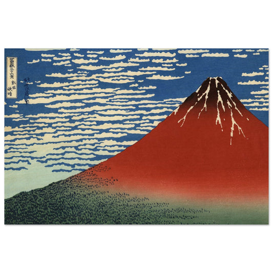 Traditional Japanese woodblock print of Mount Fuji with a blue sky and white clouds.