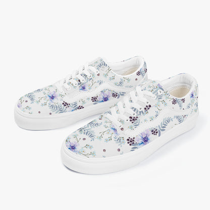 White sneakers with floral pattern on a white background