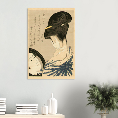 Framed artwork of a traditional Japanese scene on a wall with decor items below.