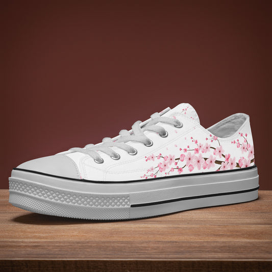 White sneaker with pink floral design on a wooden surface and brown background