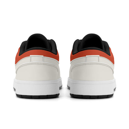 Back view of white sneakers with black and red accents on a white background