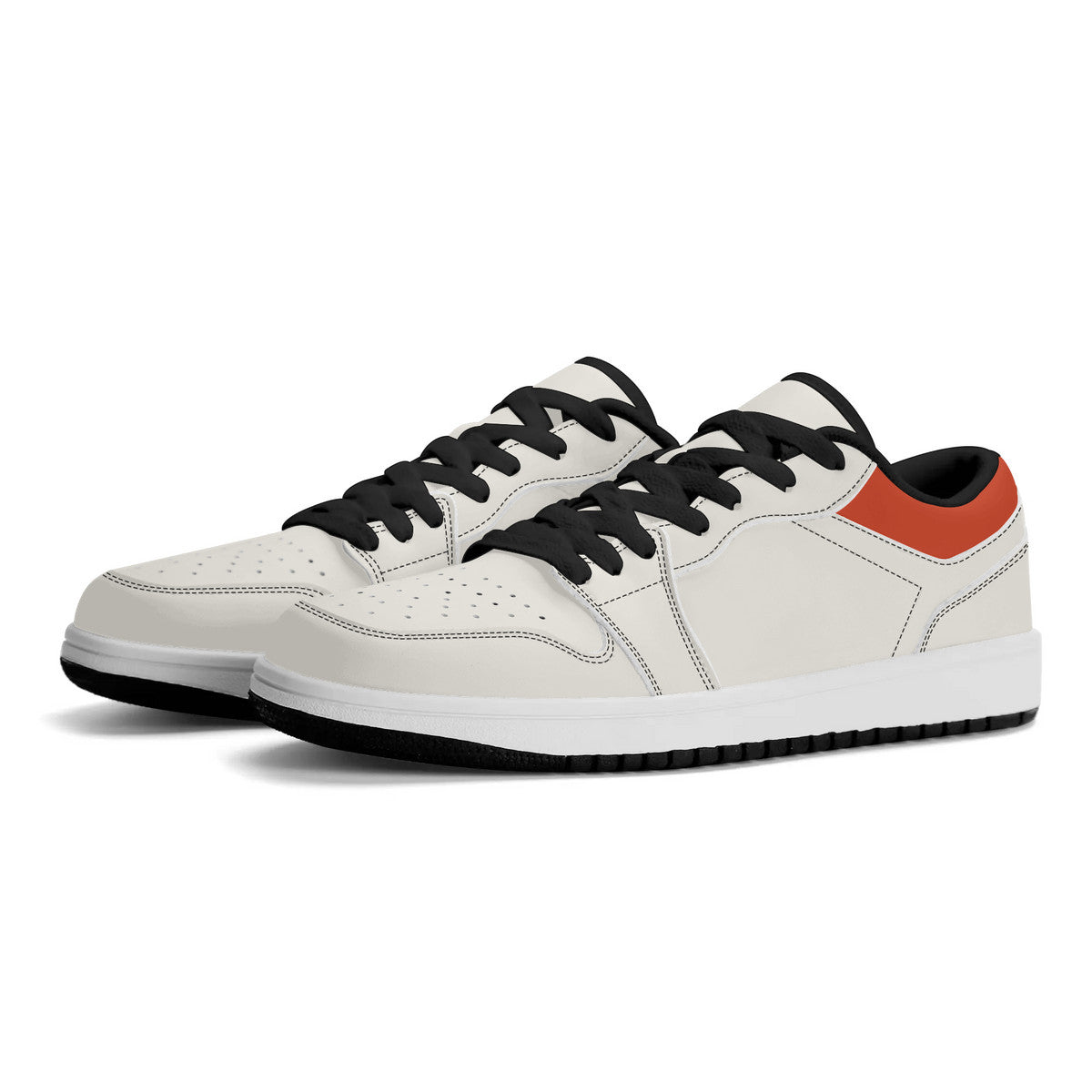 White sneakers with black laces and orange accents on a white background