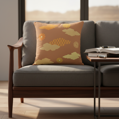 Gray sofa with a decorative pillow featuring cloud and flower patterns, in a room with a wooden floor.