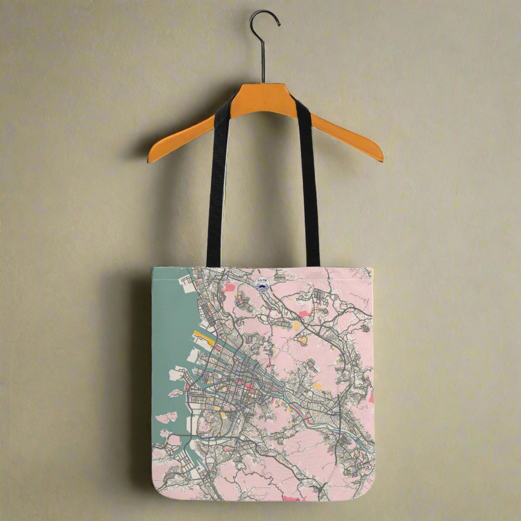 Tote bag with city map design on a hanger against a white background