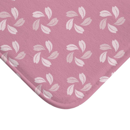 Shade of Pink Petal Flower Japanese Pattern Bath Mat.   Japanese style bathmats are the perfect finishing flourish for a stylish, personality-filled bathroom, and this bath mat is as practical, as it is stylish - the anti-slip backing keeps the bath mat firmly in place and reduces the risk of slipping. 100% Microfiber. Vibrant print exit in 2 sizes 34” x 21” (86 x 53 cm) or 24” x 17” (61 x 43 cm). Anti-slip backing. Binding around the edges. Machine wash cold, gentle cycle. Tumble dry low or line dry. 