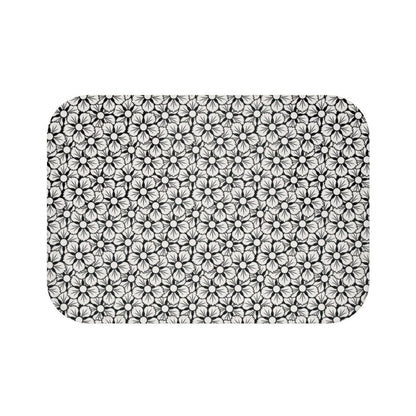 White and Black Flower Japanese Pattern Bath Mat.   Japanese style bathmats are the perfect finishing flourish for a stylish, personality-filled bathroom, and this bath mat is as practical, as it is stylish - the anti-slip backing keeps the bath mat firmly in place and reduces the risk of slipping. 100% Microfiber. Vibrant print exit in 2 sizes 34” x 21” (86 x 53 cm) or 24” x 17” (61 x 43 cm). Anti-slip backing. Binding around the edges. Machine wash cold, gentle cycle. Tumble dry low or line dry. 
