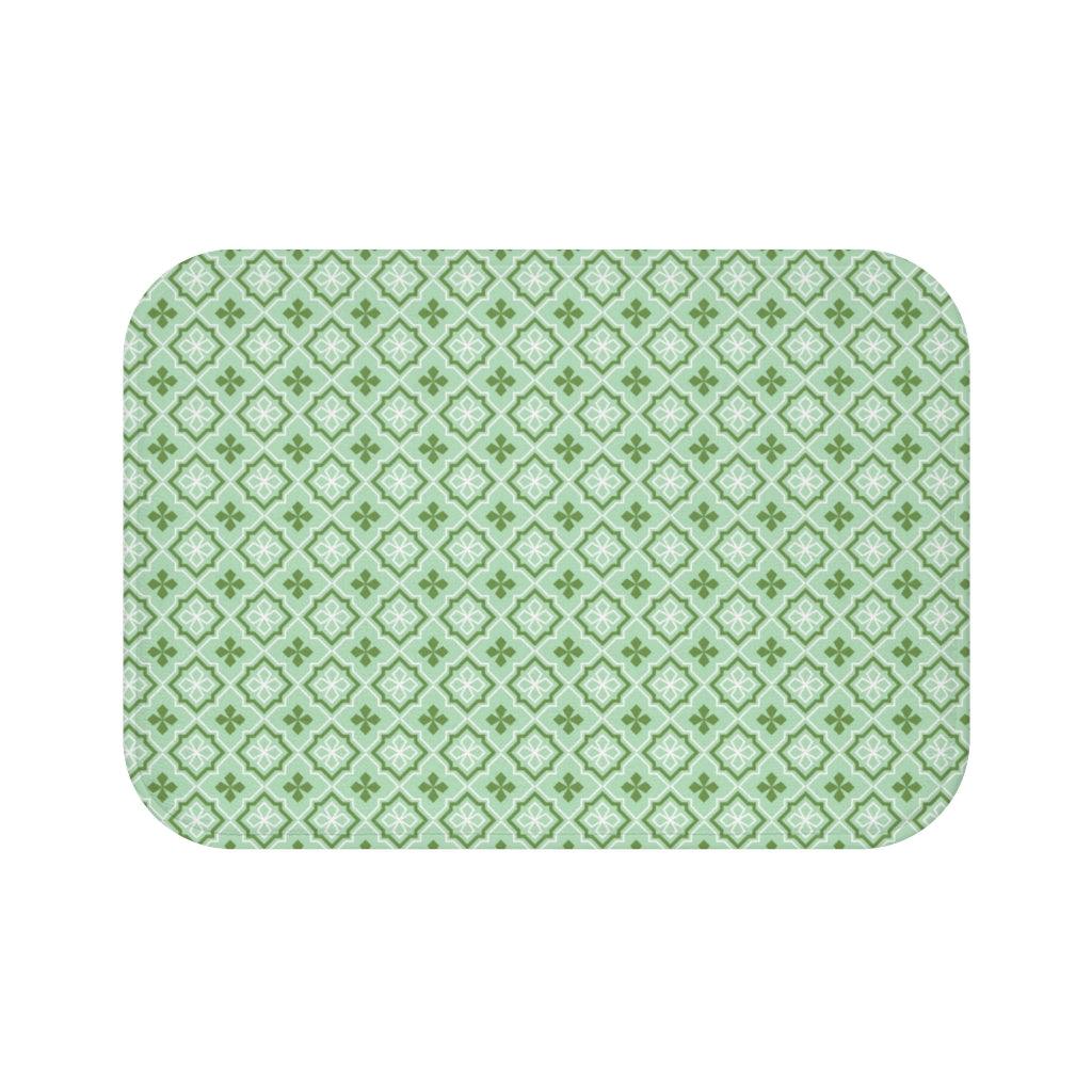 Green, White, and Mint Losange Japanese Pattern Bath Mat.   Japanese style bathmats are the perfect finishing flourish for a stylish, personality-filled bathroom, and this bath mat is as practical, as it is stylish - the anti-slip backing keeps the bath mat firmly in place and reduces the risk of slipping. 100% Microfiber. Vibrant print exit in 2 sizes 34” x 21” (86 x 53 cm) or 24” x 17” (61 x 43 cm). Anti-slip backing. Binding around the edges. Machine wash cold, gentle cycle. Tumble dry low or line dry. 