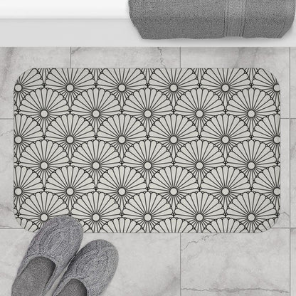 Large White Flower on Grey Japanese Pattern Bath Mat.   Japanese style bathmats are the perfect finishing flourish for a stylish, personality-filled bathroom, and this bath mat is as practical, as it is stylish - the anti-slip backing keeps the bath mat firmly in place and reduces the risk of slipping. 100% Microfiber. Vibrant print exit in 2 sizes 34” x 21” (86 x 53 cm) or 24” x 17” (61 x 43 cm). Anti-slip backing. Binding around the edges. Machine wash cold, gentle cycle. Tumble dry low or line dry. 