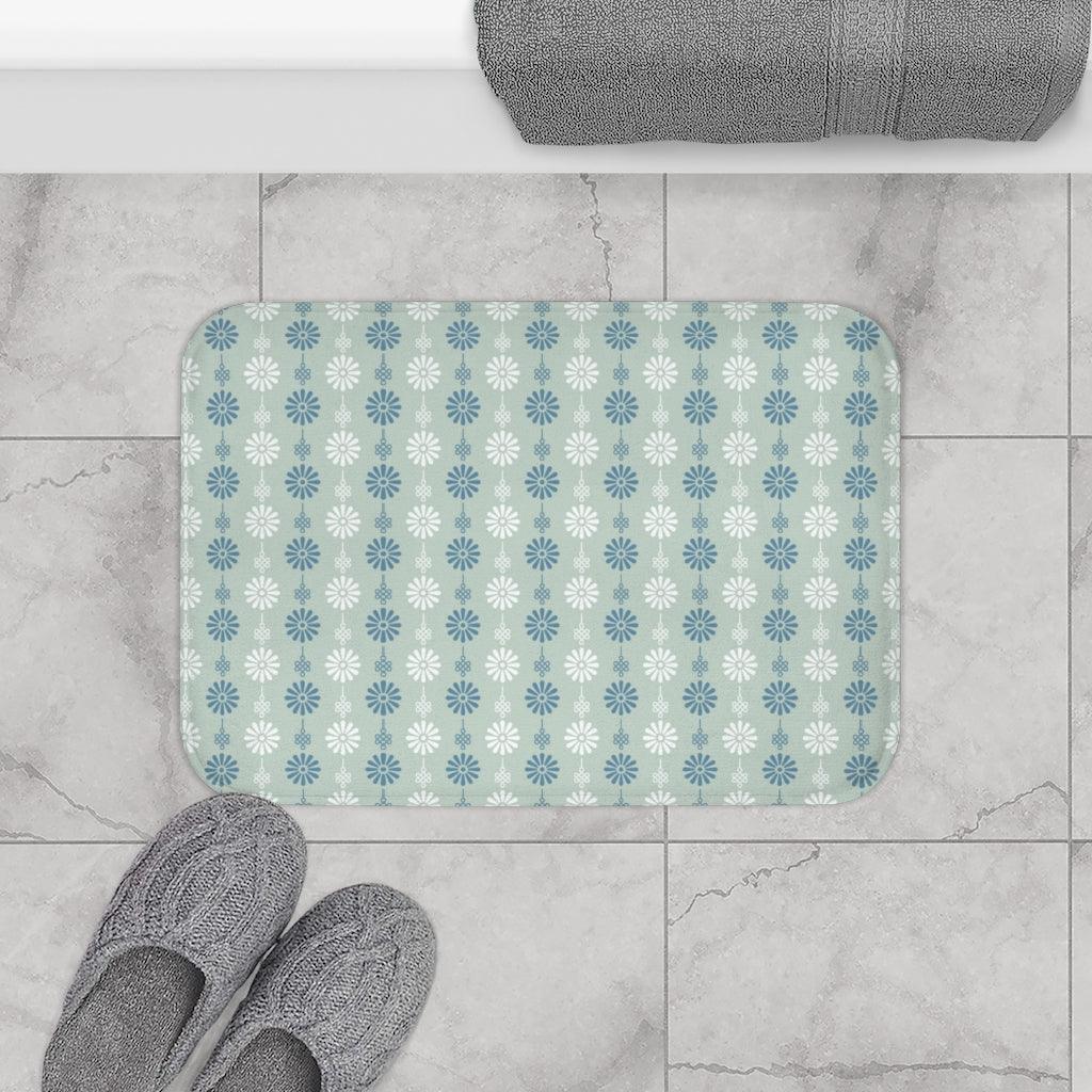 Blue, Grey and White Japanese Flower Bath Mat.   Japanese style bathmats are the perfect finishing flourish for a stylish, personality-filled bathroom, and this bath mat is as practical, as it is stylish - the anti-slip backing keeps the bath mat firmly in place and reduces the risk of slipping. 100% Microfiber. Vibrant print exit in 2 sizes 34” x 21” (86 x 53 cm) or 24” x 17” (61 x 43 cm). Anti-slip backing. Binding around the edges. Machine wash cold, gentle cycle. Tumble dry low or line dry. 