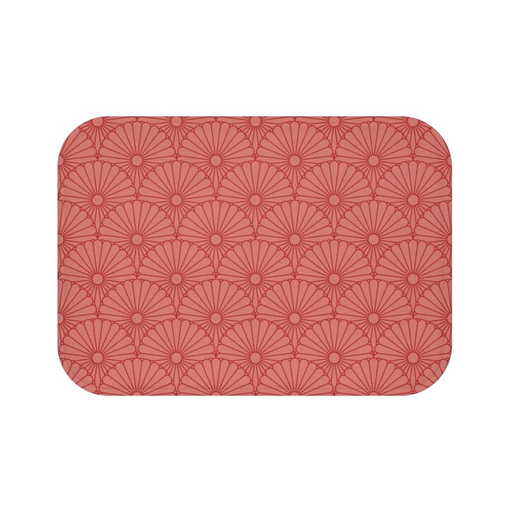 Red Flower on Strawberry Pink Bath Mat.   Japanese style bathmats are the perfect finishing flourish for a stylish, personality-filled bathroom, and this bath mat is as practical, as it is stylish - the anti-slip backing keeps the bath mat firmly in place and reduces the risk of slipping. 100% Microfiber. Vibrant print exit in 2 sizes 34” x 21” (86 x 53 cm) or 24” x 17” (61 x 43 cm). Anti-slip backing. Binding around the edges. Machine wash cold, gentle cycle. Tumble dry low or line dry. 