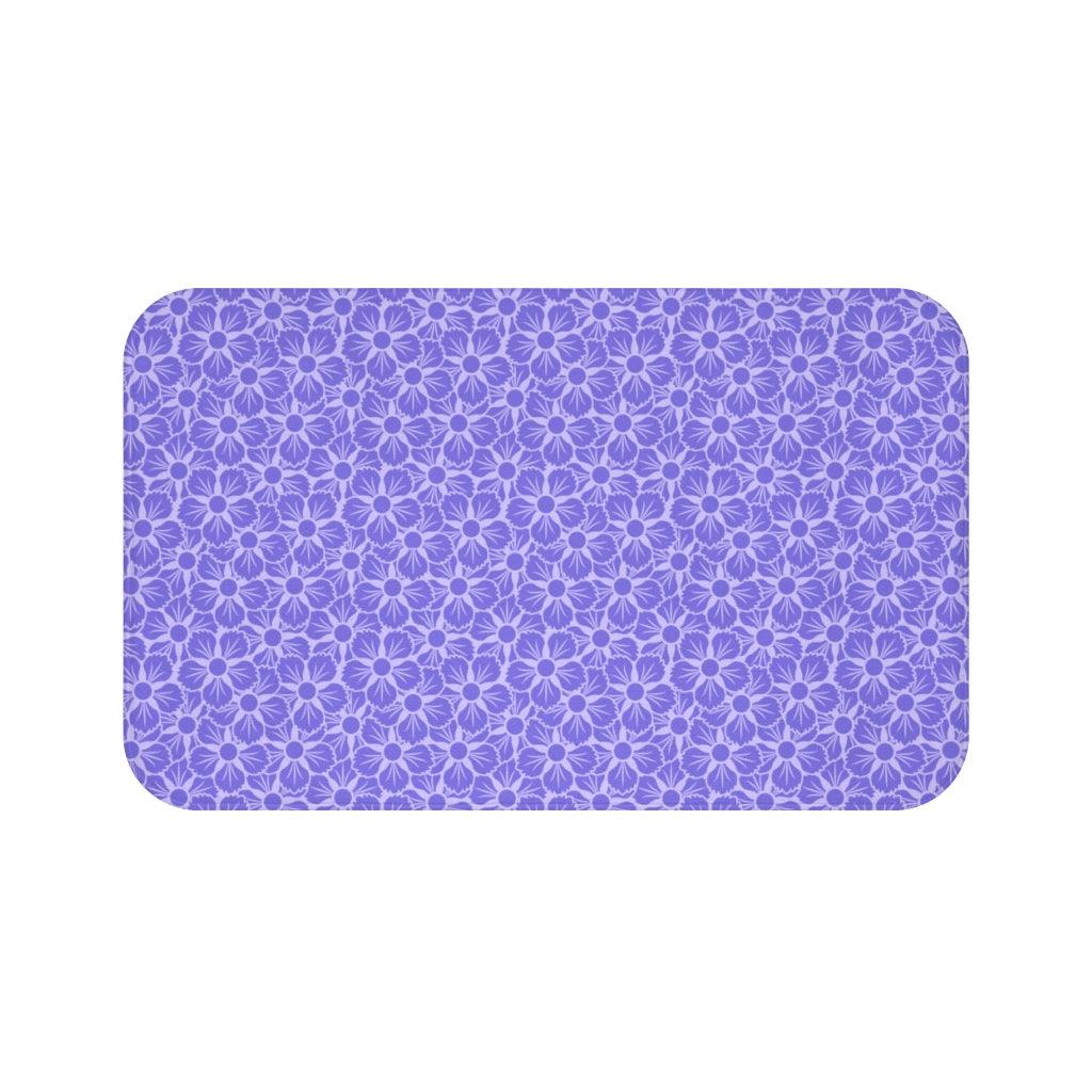 Purple Flower on White Japanese Pattern Bath Mat.   Japanese style bathmats are the perfect finishing flourish for a stylish, personality-filled bathroom, and this bath mat is as practical, as it is stylish - the anti-slip backing keeps the bath mat firmly in place and reduces the risk of slipping. 100% Microfiber. Vibrant print exit in 2 sizes 34” x 21” (86 x 53 cm) or 24” x 17” (61 x 43 cm). Anti-slip backing. Binding around the edges. Machine wash cold, gentle cycle. Tumble dry low or line dry. 