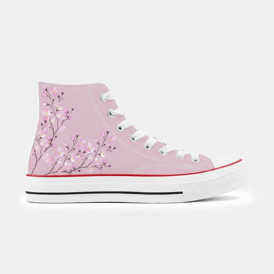 A pair of high-top canvas shoes featuring a cherry blossom design in pink on a white background.