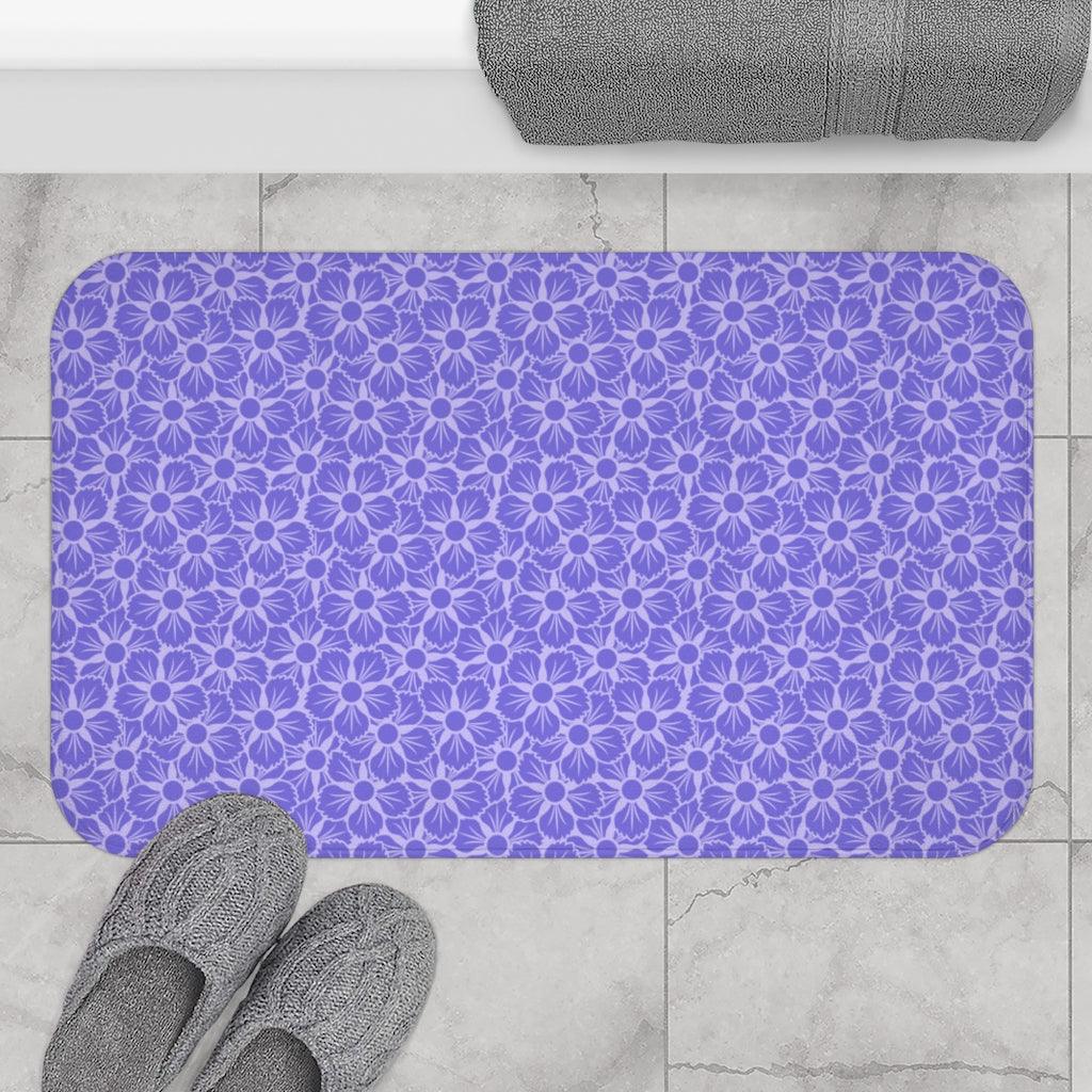 Purple Flower on White Japanese Pattern Bath Mat.   Japanese style bathmats are the perfect finishing flourish for a stylish, personality-filled bathroom, and this bath mat is as practical, as it is stylish - the anti-slip backing keeps the bath mat firmly in place and reduces the risk of slipping. 100% Microfiber. Vibrant print exit in 2 sizes 34” x 21” (86 x 53 cm) or 24” x 17” (61 x 43 cm). Anti-slip backing. Binding around the edges. Machine wash cold, gentle cycle. Tumble dry low or line dry. 