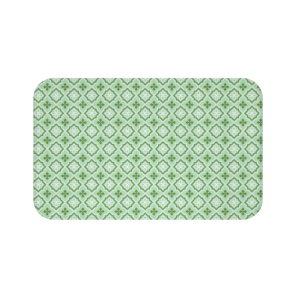 Green, White, and Mint Losange Japanese Pattern Bath Mat.   Japanese style bathmats are the perfect finishing flourish for a stylish, personality-filled bathroom, and this bath mat is as practical, as it is stylish - the anti-slip backing keeps the bath mat firmly in place and reduces the risk of slipping. 100% Microfiber. Vibrant print exit in 2 sizes 34” x 21” (86 x 53 cm) or 24” x 17” (61 x 43 cm). Anti-slip backing. Binding around the edges. Machine wash cold, gentle cycle. Tumble dry low or line dry. 