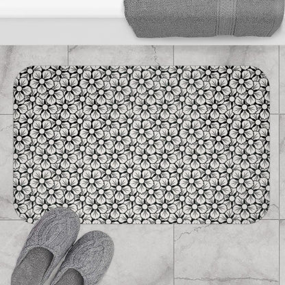 White and Black Flower Japanese Pattern Bath Mat.   Japanese style bathmats are the perfect finishing flourish for a stylish, personality-filled bathroom, and this bath mat is as practical, as it is stylish - the anti-slip backing keeps the bath mat firmly in place and reduces the risk of slipping. 100% Microfiber. Vibrant print exit in 2 sizes 34” x 21” (86 x 53 cm) or 24” x 17” (61 x 43 cm). Anti-slip backing. Binding around the edges. Machine wash cold, gentle cycle. Tumble dry low or line dry. 