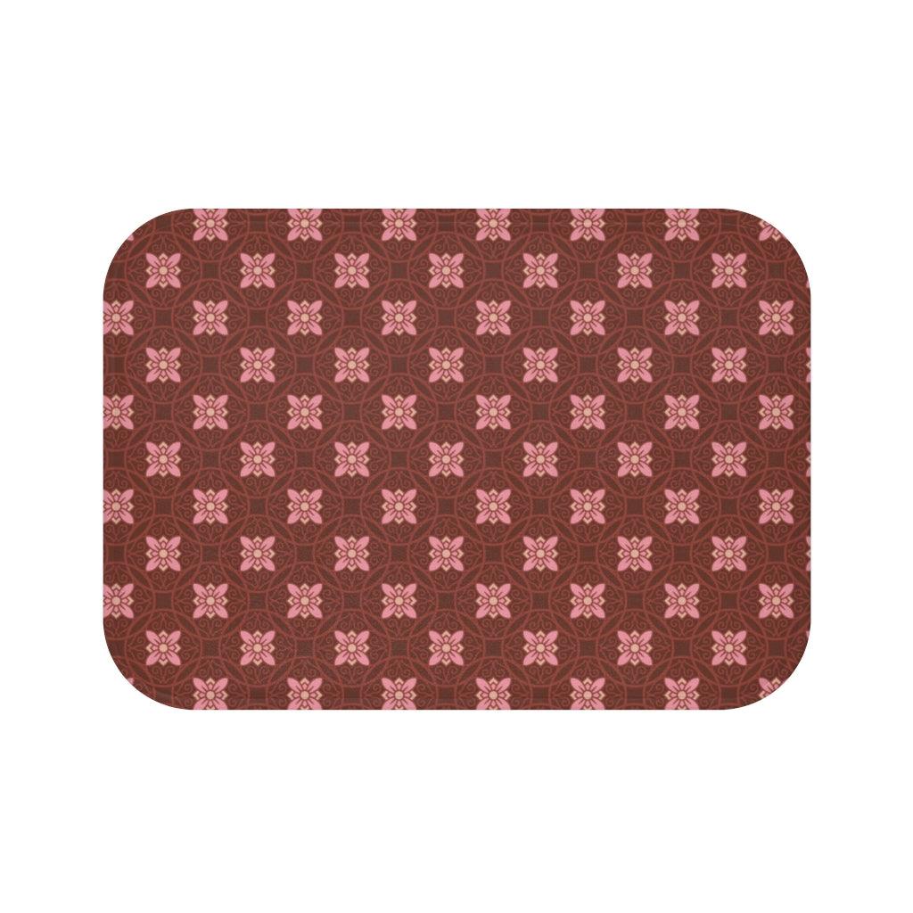 Pink Flower on Dark Burgundy Japanese Pattern Bath Mat.   Japanese style bathmats are the perfect finishing flourish for a stylish, personality-filled bathroom, and this bath mat is as practical, as it is stylish - the anti-slip backing keeps the bath mat firmly in place and reduces the risk of slipping. 100% Microfiber. Vibrant print exit in 2 sizes 34” x 21” (86 x 53 cm) or 24” x 17” (61 x 43 cm). Anti-slip backing. Binding around the edges. Machine wash cold, gentle cycle. Tumble dry low or line dry. 