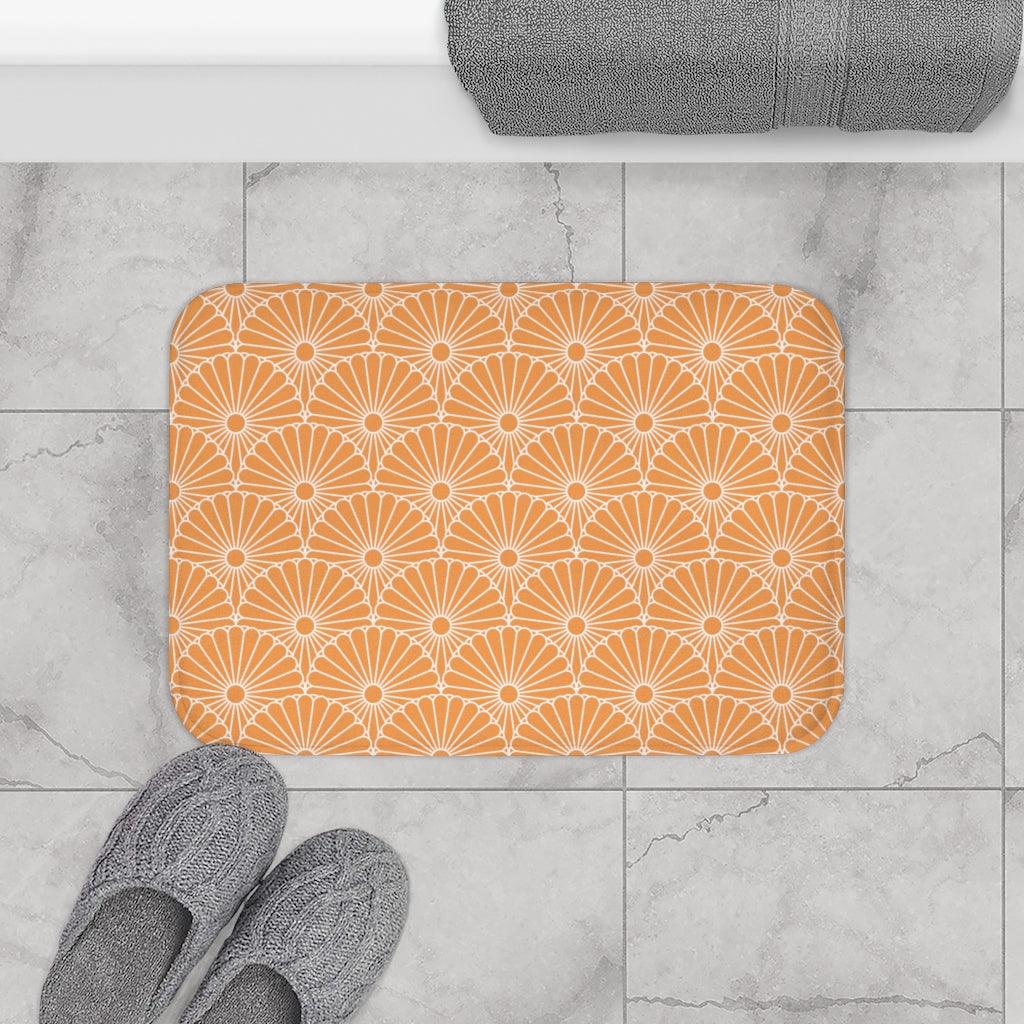 White Flowers on a Light Orange Background Bath Mat.   Japanese style bathmats are the perfect finishing flourish for a stylish, personality-filled bathroom, and this bath mat is as practical, as it is stylish - the anti-slip backing keeps the bath mat firmly in place and reduces the risk of slipping. 100% Microfiber. Vibrant print exit in 2 sizes 34” x 21” (86 x 53 cm) or 24” x 17” (61 x 43 cm). Anti-slip backing. Binding around the edges. Machine wash cold, gentle cycle. Tumble dry low or line dry. 
