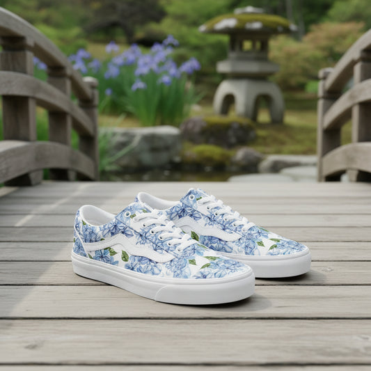 Premium low-top canvas sneakers featuring a deep indigo blue background adorned with delicate white and soft-blue cherry blossom clusters.