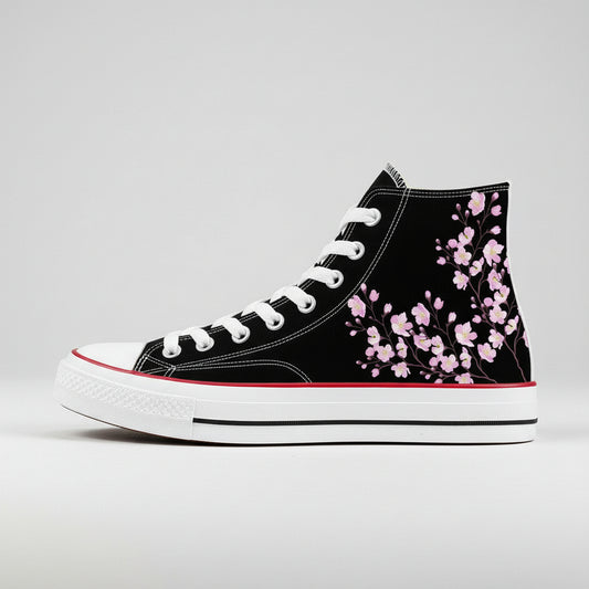 A pair of high-top canvas shoes featuring a cherry blossom design in pink on a white background.