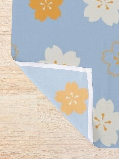 Orange and White Flower on Blue Origami Shower Curtain.   Shower curtain with vibrant Japanese Pattern colors which will brighten your bathroom. Our Shower curtains are made of 100% Polyester and include 12 holes at the top for easy placement. Decorate your wet room or shower room with these superb curtains. Total dimension are 71'x74' or 180cmx188cm