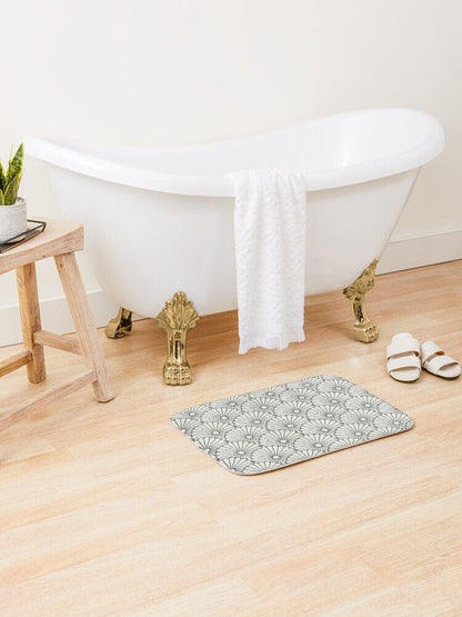 Large White Flower on Grey Japanese Pattern Bath Mat.   Japanese style bathmats are the perfect finishing flourish for a stylish, personality-filled bathroom, and this bath mat is as practical, as it is stylish - the anti-slip backing keeps the bath mat firmly in place and reduces the risk of slipping. 100% Microfiber. Vibrant print exit in 2 sizes 34” x 21” (86 x 53 cm) or 24” x 17” (61 x 43 cm). Anti-slip backing. Binding around the edges. Machine wash cold, gentle cycle. Tumble dry low or line dry. 