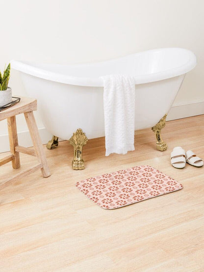 Red Spiral on Pink Background Japanese Pattern Bath Mat.   Japanese style bathmats are the perfect finishing flourish for a stylish, personality-filled bathroom, and this bath mat is as practical, as it is stylish - the anti-slip backing keeps the bath mat firmly in place and reduces the risk of slipping. 100% Microfiber. Vibrant print exit in 2 sizes 34” x 21” (86 x 53 cm) or 24” x 17” (61 x 43 cm). Anti-slip backing. Binding around the edges. Machine wash cold, gentle cycle. Tumble dry low or line dry. 